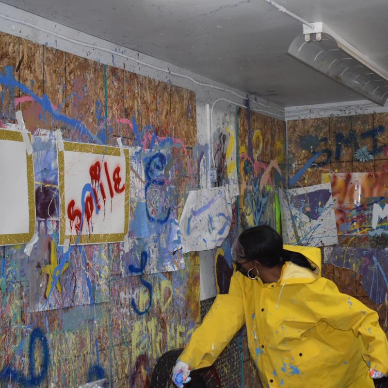 woman having fun at unity rage room